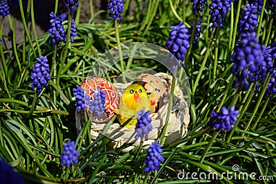 Colorful painted easter eggs on a basket on a green grass Stock Photo