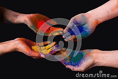 Colorful painted hands, holding holi isolated Stock Photo