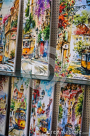Colorful Paintings of Lisbons Iconic Scenes Displayed for Sale in Lisbon, Portugal Editorial Stock Photo