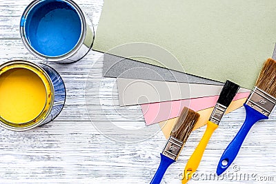 Colorful paints and brushes on grey wooden desk background top view copyspace Stock Photo