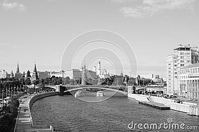 Colorful panorama of Moscow - Kremlin, Moskva river embankment, Big stone bridge, pleasure boat,, Russia, Europe. Editorial Stock Photo