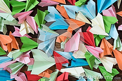 Colorful paper airplanes on wooden table background Stock Photo