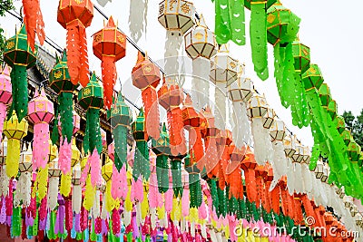 Colorful paper lanterns hanging for worship or respect of buddha in Thai temple Stock Photo