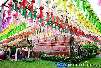 Colorful paper lanterns hanging for worship or respect of buddha in Thai temple Stock Photo