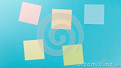 Colorful paper stickers on blue background Stock Photo