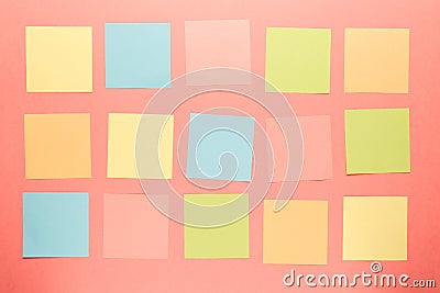 Colorful paper stickers on coral background Stock Photo