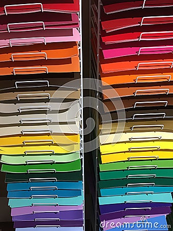 Colorful papers on shelves for sale Stock Photo