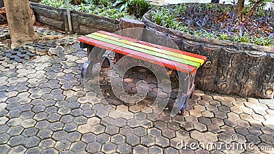 Colorful park wooden bench after rain Stock Photo