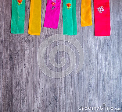 Colorful part of korean dress on wood background Stock Photo