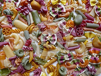 Colorful Pasta, Loop Noodles, Italian Pasta, Farfalle, Fusilli, Penne and others. Background, close-up, format-filling. Stock Photo