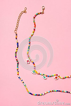 Colorful pastel accessories hairpin on pink background, close up, trendy modern from past Stock Photo