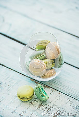 Colorful pastel French macaron biscuits in glass, copy space Stock Photo