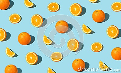 Colorful pattern of fresh ripe whole and sliced oranges Stock Photo
