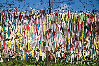 Colorful peace ribbons tied at a fence at the demilitarised zone DMZ at the freedom bridge, South Korea, Asia Editorial Stock Photo