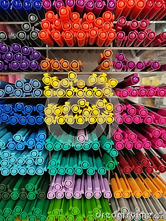 Colorful pen on shelves in stationery store or department store, Colorful highlight pen on shelf, focused on yellow highlight pen Stock Photo