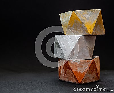 Colorful pentagon geometric planters. Painted concrete planters for home decoration Stock Photo