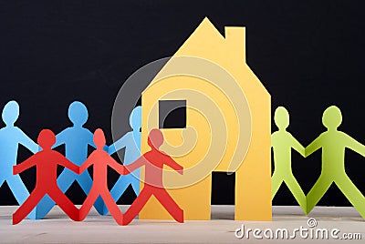 Colorful People and a House Stock Photo
