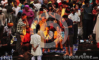 Colorful People and Priest Worship/Offer Puja, Haridwar, India Editorial Stock Photo