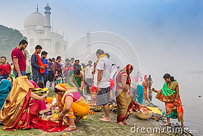 Colorful people at the river behind the Taj Mahal in Agra Editorial Stock Photo