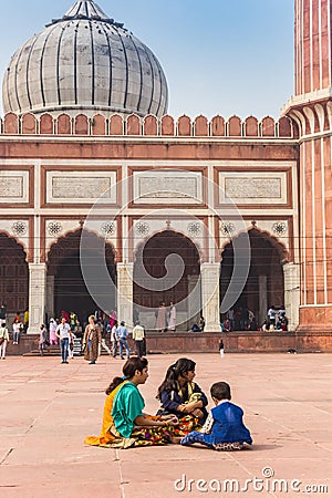 Colorful people sitting on the square of the Jama Masjid in New Delhi Editorial Stock Photo