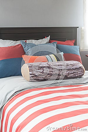 Colorful pillows on bed in single bedroom Stock Photo