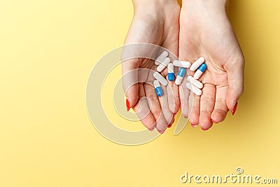 Colorful pills and tablets in the woman hands Stock Photo