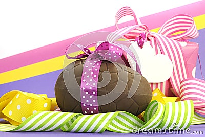 Colorful pink, yellow and purple theme Happy Easter theme with chocolate egg and gift box Stock Photo