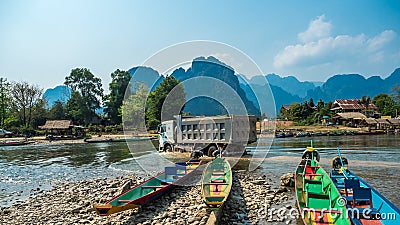 Colorful Pirogues on Nam Song River, Laos Stock Photo