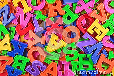 Colorful plastic alphabet letters as background Stock Photo