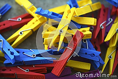 Colorful Plastic Clothespins Scattered Stock Photo