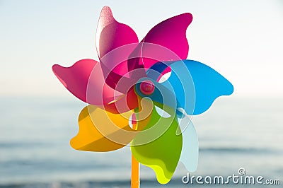 Colorful plastic toys. Windmill. Colorful background Stock Photo