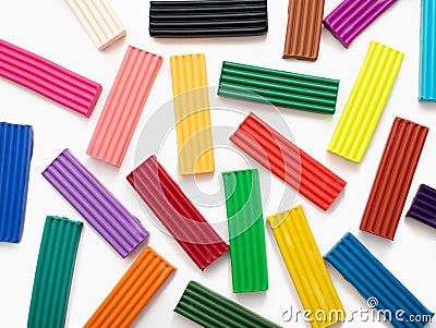 Colorful plasticine modelling clay sticks pattern isolated on white background with clipping path. Top view Stock Photo