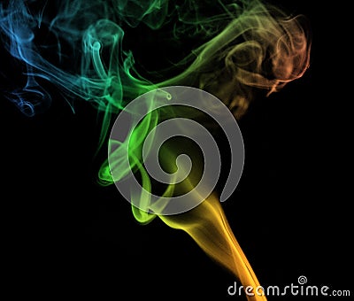Colorful plume smoke isolated on black background. Stock Photo