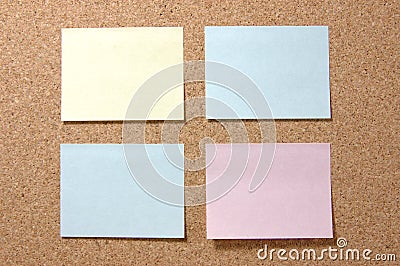 Colorful post-it notes on corkboard Stock Photo