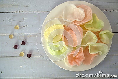 Colorful prawn cracker in white plate, top view of candies and shrimp crackers Stock Photo