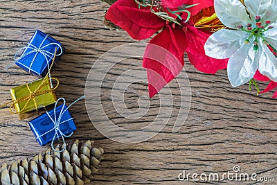 Colorful present boxes, pine, flowers on wooden background with Stock Photo