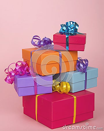 Colorful present boxes with ribbon stacked asymmetrically Stock Photo