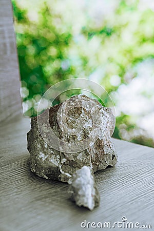 colorful purple stone and planetoid on green background Stock Photo