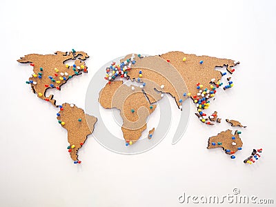 Colorful pushpin for marking location at wooden world map on the wall Stock Photo