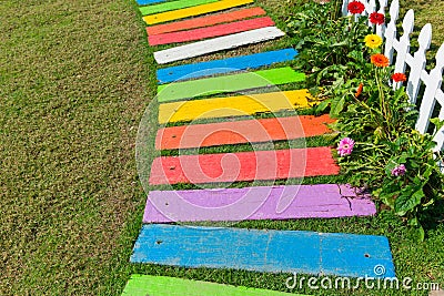 Colorful rainbow foot path garden decoration. Stock Photo