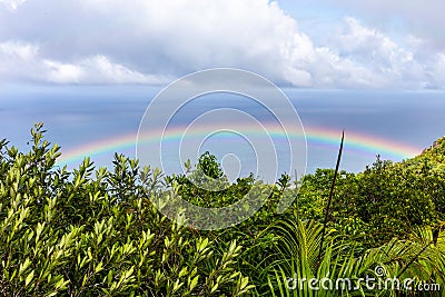 Colorful rainbow over Praslin Island, Seychelles. Stock Photo