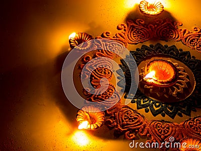 Colorful Rangoli With Diya, On Diwali Festival Stock Photo