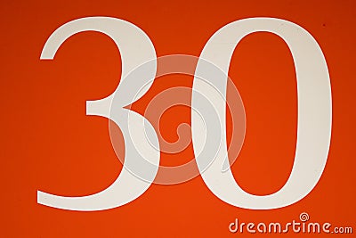 Colorful red and white sign with the number .thirty - 30 Stock Photo