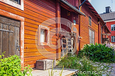 The colorful red wooden warehouses of Porvoo in Finland during a warm summer day - 3 Stock Photo