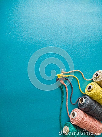 Colorful reels of macrame cord threads or wool shot as copy space background or text background Stock Photo
