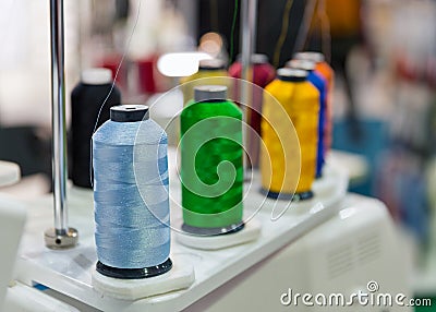 Colorful reels of threads on professional machine for applying embroidery Stock Photo