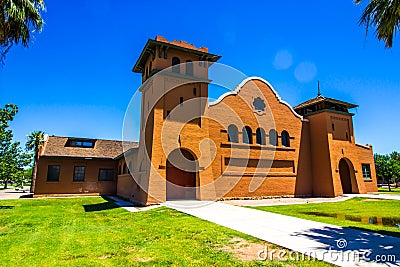 Colorful Retro Brick Building With Boarded Up Entrance Stock Photo