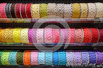Colorful Ric Rac ribbon on rack in craft shop Stock Photo