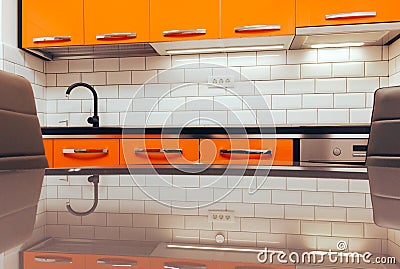 Small modern orange kitchen renovated in new apartment Stock Photo