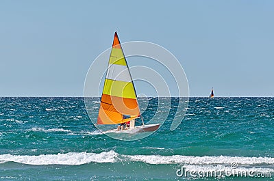 Colorful Sailboat Sailing on a Windy Sunny Summer Day on Georgian Bay Stock Photo